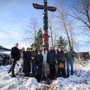 Group in front of totem pole